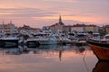 Budva bay sunrise. Panoramic view of marina, boats and old city