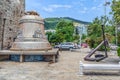 Budva Bell and steel anchor near the fortress walls of the Old Town of Budva