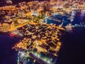 Budva city lights from Montenegro seen from above. Night view. Drone old town Budva at night