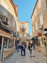 Tourists discovering the narrow streets of Old Town in Budva Royalty Free Stock Photo