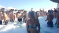 Budva, Montenegro - August 23, 2019: girl dancing in the foam in the pool, bar at a party in the afternoon
