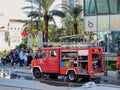 Budva, Montenegro - 09 august 2023: People stand near a fire truck parked near a multi-storey building