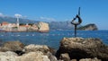 Budva Montenegro 8.15.22 Beautiful bronze sculpture of dancer girl, frozen in graceful pose and dancing. Mogren beach Royalty Free Stock Photo