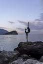 Budva, Montenegro, Dancing Girl with view on Sveti Nicola island with moon Royalty Free Stock Photo