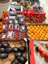 Budva, Montenegro - 25 december 2022: Avocados, peaches, lychee berries, raspberries, strawberries lie in boxes on the Royalty Free Stock Photo