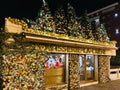 Budva, Montenegro - 25 december 2022: Confectionery store showcase decorated with balls and Christmas trees