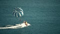 BUDVA, MONTENEGRO - JULY 26, 2018. Parasailing parachute and speedboat at sea Royalty Free Stock Photo