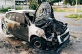 Budva, Montenegro - 17 march 2021: Citroen C3 2016 passenger car burnt out and extinguished by firefighters. Wiring
