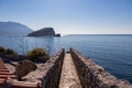 Budva - Scenic view over Saint Nicholas island (Sveti Nikola) and Adriatic Sea seen from walls of the citadel Royalty Free Stock Photo