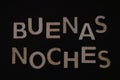 buenas noches write on black background Royalty Free Stock Photo