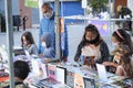 Families browsing books, touring the Felba, a book fair in Buenos Aires