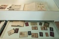 Old documents in the wooden boxes with glass lids at the National Immigration Museum of Buenos Aires