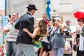 BUENOS AIRES, ARGENTINA - DECEMBER 25, 2017: Couple dancing tango on city street. With selective focus