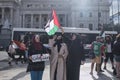 Women raising a Palestinian flag in Argentina, in solidarity with Palestine