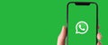 In this illustrative photo you can see the Whatsapp logo displayed on a smartphone. Banner horizontal