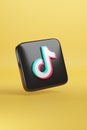 Buenos Aires, Argentina - January 12th, 2024: Tiktok icon isolated on yellow background. 3d illustration