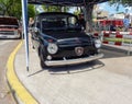 black Fiat 600 sedan two door rear engined unibody c 1970. Side view. Expo Warnes 2021 classic car