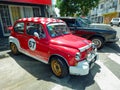 sporty red and white Fiat 600 Abarth sedan unibody for racing. E