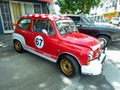 sporty red and white Fiat 600 Abarth sedan unibody for racing. E