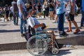 Disabled person in a wheelchair on the day of farewell to Diego Maradona in Buenos Aires Royalty Free Stock Photo