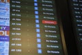 Screen with information on flight departures, all on schedule except one delayed Royalty Free Stock Photo