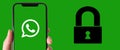 WhatsApp logo is displayed on a smartphone screen and an illustration of a padlock - WhatsApp and security concept - Horizontal