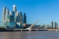 Buenos Aires city skyline. View of Puente de la Mujer Women`s Bridge , Puerto Madero