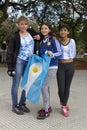 Buenos Aires State/Argentina 06/25/2014. Three females Argentina soccer team fans posing with argentina flag during The soccer wor