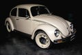 White Volkswagen Beetle in black background Royalty Free Stock Photo