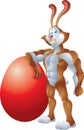 Buff rabbit leaning on giant egg