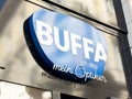 Buffa optician storefront signage with blue background and white letters Royalty Free Stock Photo