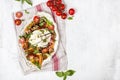 Buffalo burrata cheese with fresh raw tomatoes and basil