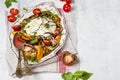 Buffalo burrata cheese with fresh raw tomatoes and basil