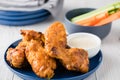 Buffalo chicken wings with celery carrot sticks Royalty Free Stock Photo
