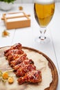 Buffalo chicken wings fried in sauce with glass of beer Royalty Free Stock Photo