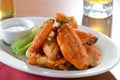 Buffalo Chicken Wings with Out of Focus Beers Royalty Free Stock Photo