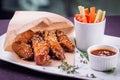 Buffalo chicken wings with sauce and vegetable sticks Royalty Free Stock Photo