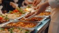 Buffet Dining with Diverse Hot Dishes Served by Guests in Formal Event Setting Royalty Free Stock Photo