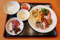 Buffet dinner food with onsen egg , ferment squid , salmon and scallop grilled , sausage and bacon at hotel Noboribetsu , Japan