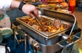 Close-up of a marmite buffet with a delicious beef dish inside