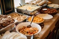 buffet full of burritos, tacos, and nachos for guests to choose from