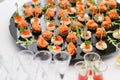 Buffet at the gala dinner. Assortment of canapes. Banquet service. catering food, snacks with salmon and caviar. rye Royalty Free Stock Photo