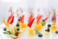 Buffet at the gala dinner. Canapes with cheese, pineapple and strawberries. Assortment of canapes. Banquet service