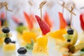 Buffet at the gala dinner. Canapes with cheese, pineapple and strawberries. Assortment of canapes. Banquet service