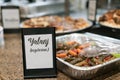 a buffet has a sign that says yallali, vegetarian Royalty Free Stock Photo