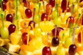 Buffet with pineapple and grapes appetizers and other fruits in restaurant Royalty Free Stock Photo