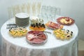 Buffet at reception. Assortment of canapes. Banquet service. Catering, snacks with different types of cheeses and meats. Royalty Free Stock Photo