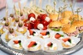 The buffet at the reception. Assortment of canapes on a table. Banquet service. Catering food, snacks with different types of Royalty Free Stock Photo