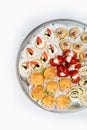 The buffet at the reception. Assortment of canapes on a table. Banquet service. Catering food, snacks with different types of Royalty Free Stock Photo