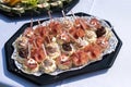 The buffet at the reception. Assortment of canapes on a table. Banquet service. Catering food, snacks with different types of Royalty Free Stock Photo